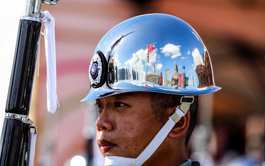 A Taiwanese flag is reflected on one of the Ministry of National Defense Honour Guards' helmet during the Double Tenth Day celebration in Taipei, Taiwan, on 10 October 2021. (I-Hwa Cheng/Bloomberg)
