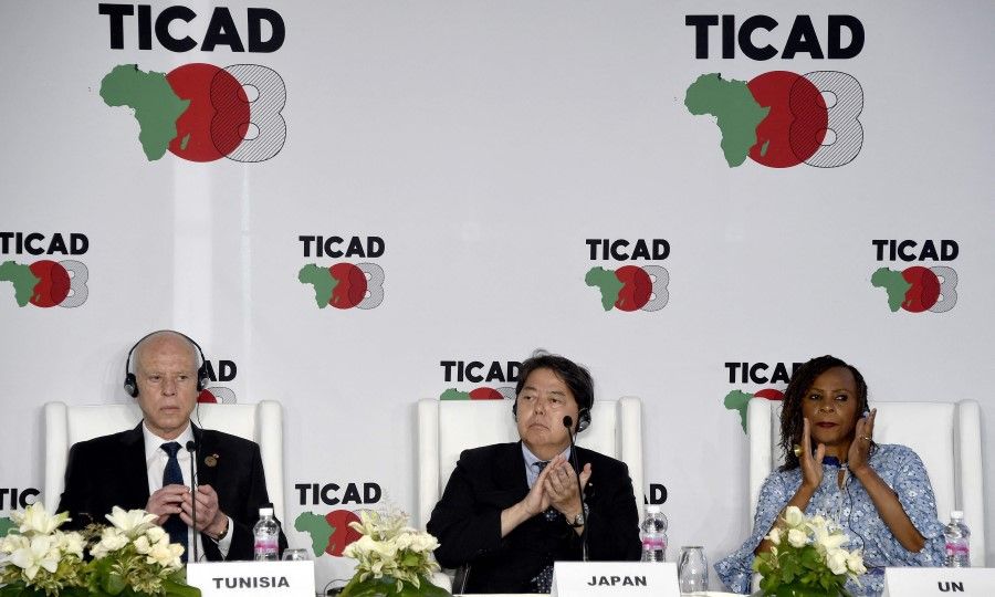 (Left to right) Tunisia's President Kais Saied, Japan's Foreign Minister Yoshimasa Hayashi, and United Nations' Deputy Secretary-General Amina J. Mohamed applaud during a press conference after the closing session of the eighth Tokyo International Conference on African Development (TICAD) in Tunisia's capital Tunis on 28 August 2022. (Fethi Belaid/AFP)