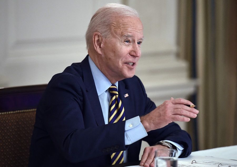 US President Joe Biden speaks during a virtual meeting with members of the Quad alliance of Australia, India, Japan and the US, in the State Dining Room of the White House in Washington, DC, US, on 12 March 2021. (Olivier Douliery/AFP)