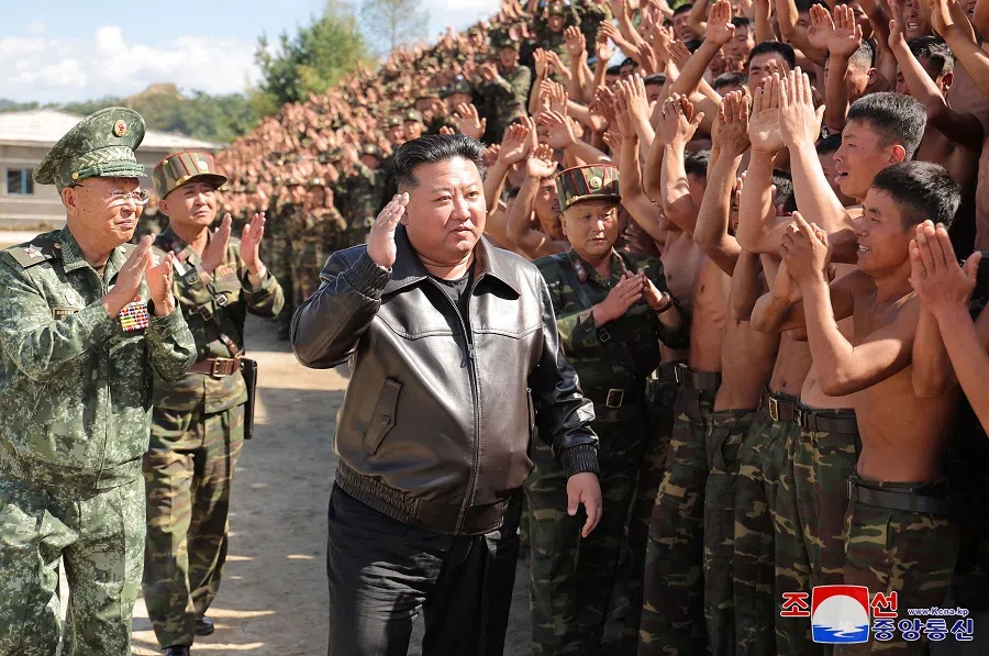 This picture taken on 2 October 2024 and released from North Korea’s official Korean Central News Agency (KCNA) via KNS on 4 October 2024 shows North Korea’s leader Kim Jong Un (centre) inspecting a training base of the Korean People’s Army’s special operations forces in the western region, at an undisclosed location in North Korea. (KCNA via KNS/AFP)
