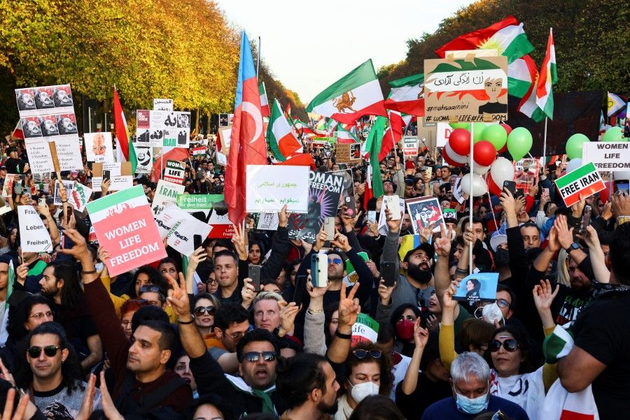Demonstrators protest following the death of Mahsa Amini in Iran, in Berlin, Germany, 22 October 2022. (Christian Mang/Reuters)