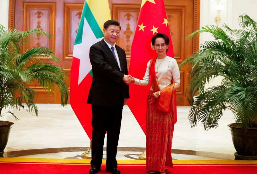 Chinese President Xi Jinping (left) and Myanmar State Counsellor Aung San Suu Kyi shake hands before a bilateral meeting at the Presidential Palace in Naypyidaw on 18 January 2020. (Nyein Chan Naing/POOL/AFP)