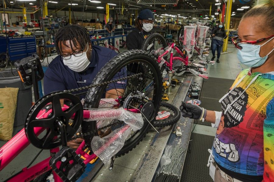 Bicycle Corporation Of America employees work on the assembly line at a Kent Bicycles production facility in Manning, South Carolina, U.S., on 13 May 2021. (Micah Green/Bloomberg)