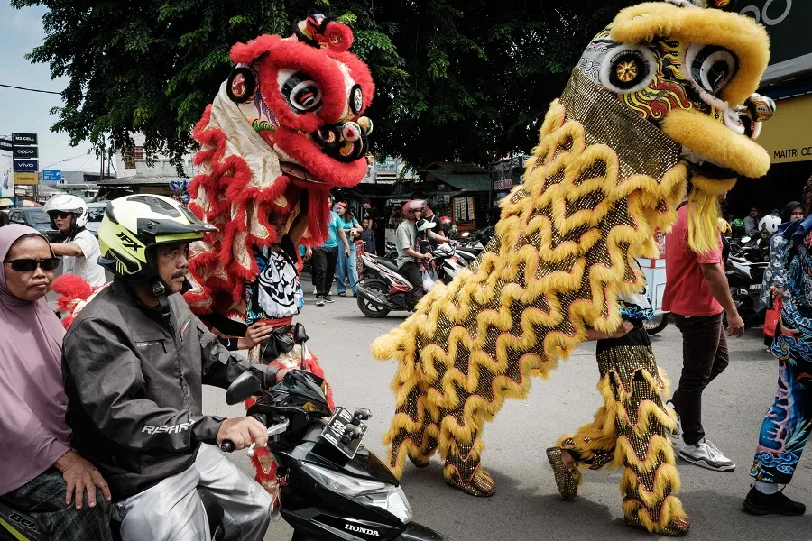 Lion dance performers walk to attend the Cap Go Meh festival, to mark the last day of the Lunar New Year of the Dragon, at the Guan Yu temple in Karawang, West Java, Indonesia, on 25 February 2024.
