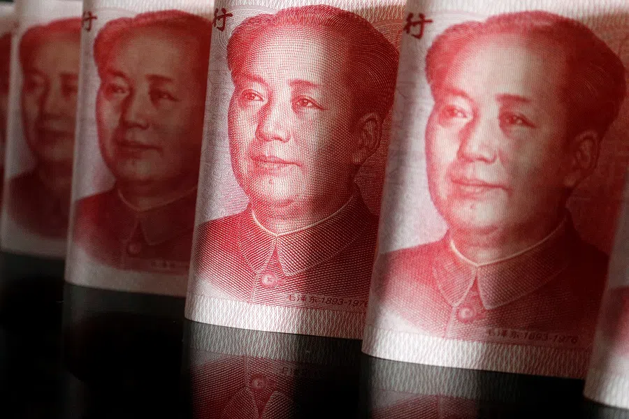 Chinese RMB banknotes are seen in this illustration picture taken 25 April 2022. (Florence Lo/Illustration/Reuters)