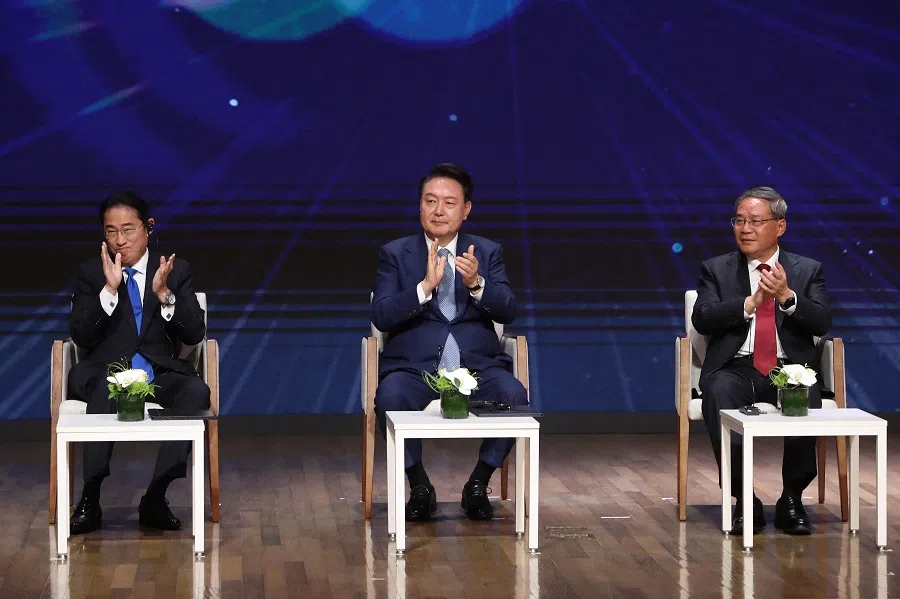 From left to right, Japan’s Prime Minister Fumio Kishida, South Korea’s President Yoon Suk Yeol, and China’s Premier Li Qiang attend the business summit at the Korea Chamber of Commerce and Industry in Seoul on 27 May 2024.  (Chung Sung-Jun/AFP)