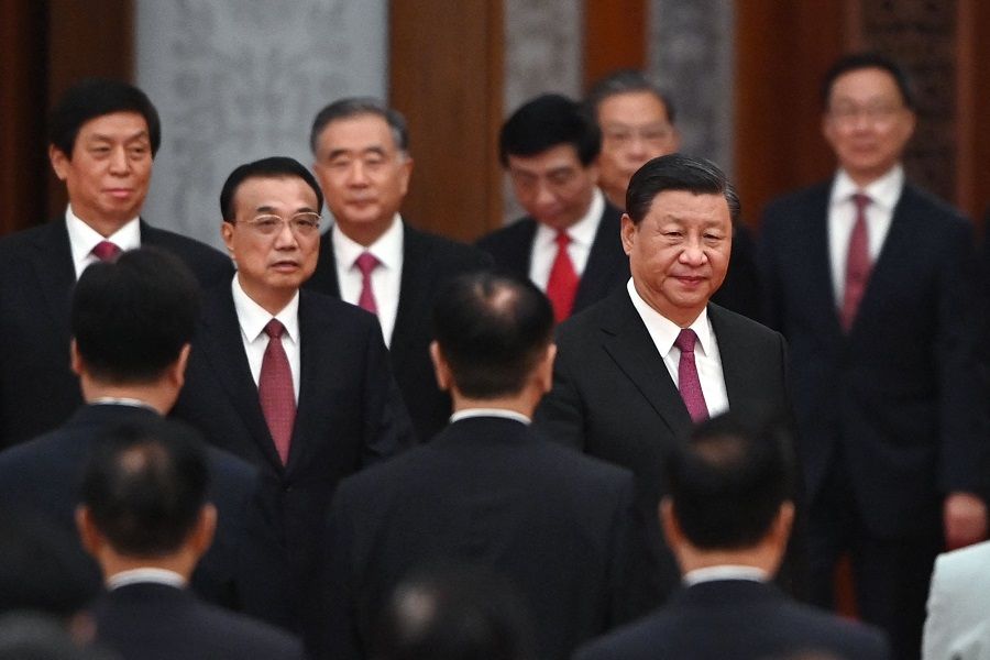 Chinese President Xi Jinping (right) arrives with Premier Li Keqiang (left) and members of the Politburo Standing Committee for a reception at the Great Hall of the People on the eve of China's National Day on 30 September 2021. (Greg Baker/AFP)
