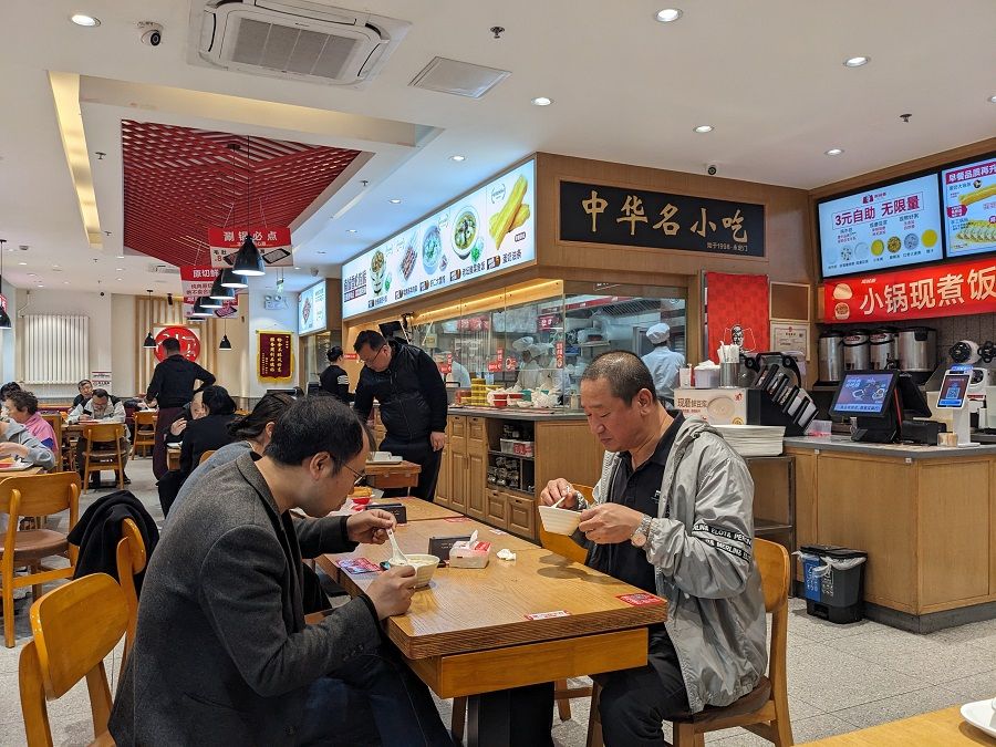 People having breakfast at a Nanchengxiang fast-food chain outlet in Beijing, China. (SPH Media)