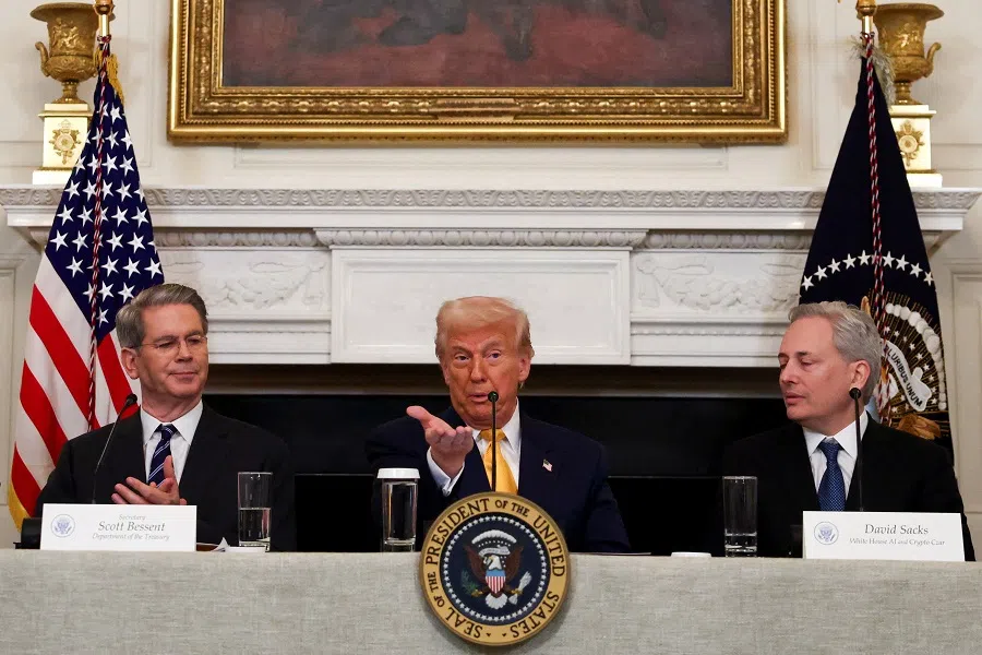 US President Donald Trump speaks next to Crypto czar David Sacks and US Treasury Secretary Scott Bessent at the White House Crypto Summit at the White House in Washington, DC, US, on 7 March 2025. (Evelyn Hockstein/Reuters)