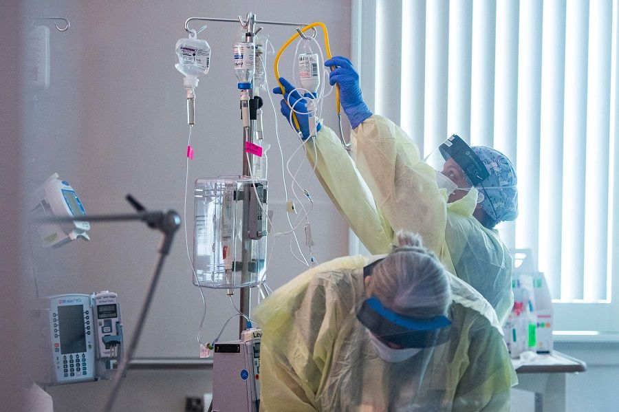 Nurses care for a Covid-19 patient inside the ICU (intensive care unit) at Adventist Health in Sonora, California, US, on 27 August 2021. (Nic Coury/AFP)