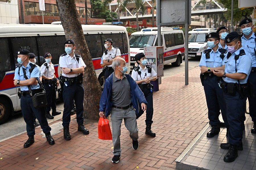 Police gather as the League of Social Democrats prepare to hold a protest against Beijing's plan to change Hong Kong's electoral system in Hong Kong on 17 March 2021. (Peter Parks/AFP)