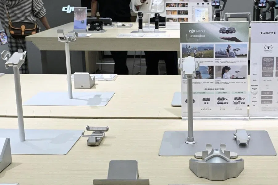 Empty display stands for drones are seen at a DJI store at a mall in Beijing on 29 April 2026, ahead a ban against the sale of consumer drones by the city government. (Adek Berry/AFP)