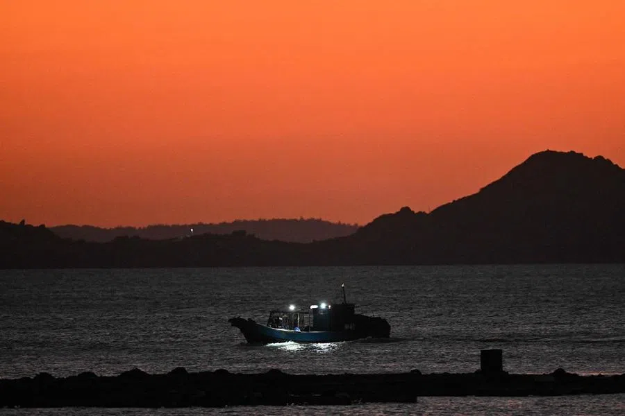 A fishing boat is seen from Pingtan island, Fujian province, China, on 29 December 2025. (Adek Berry/AFP)