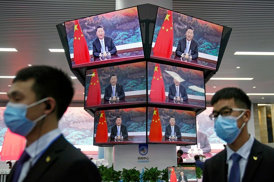 Chinese President Xi Jinping is seen on screens in the media center as he speaks at the opening ceremony of the third China International Import Expo (CIIE) in Shanghai, China, 4 November 2020. (Aly Song/Reuters)