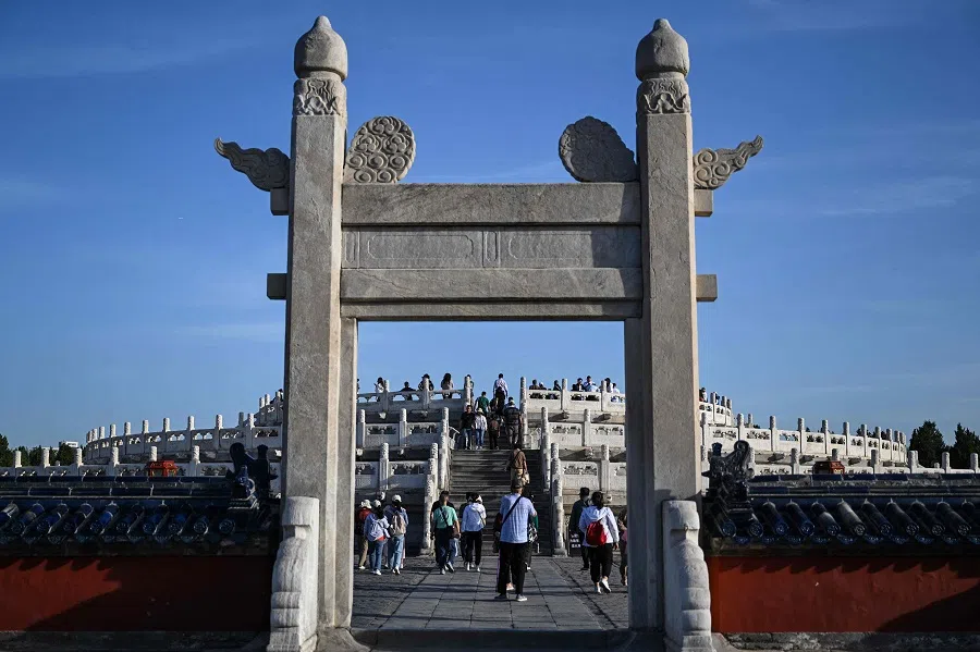 People visit the Circular Mound Altar at the Temple of Heaven in Beijing on 14 May 2024.  (Hector Retamal/AFP)