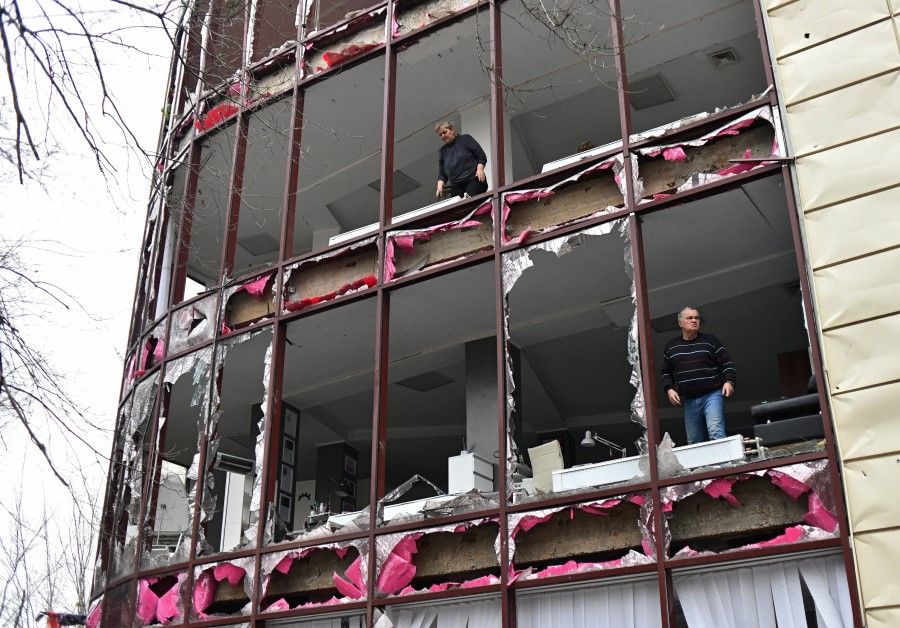 People remove debris inside a building housing a beauty salon, following recent shelling in the course of Russia-Ukraine conflict in Donetsk, Russian-controlled Ukraine, 3 December 2023. (Valery Melnikov/Reuters)