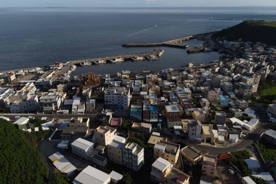 This aerial photo taken on 30 May 2022 shows the local fishing village of Neian in Xiyu Township on the Penghu islands. In the sleepy fishing towns on the Penghu islands, many locals are sanguine despite the frequent - and noisy - reminders of the military threat by neighbouring China. (Sam Yeh/AFP)