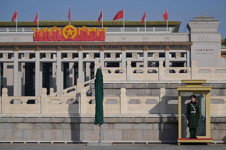 A Chinese paramilitary police officer stands guard at Tiananmen Square in Beijing on 3 March 2024, ahead of the country's annual legislative meetings known as the "Two Sessions". (Pedro Pardo/AFP)