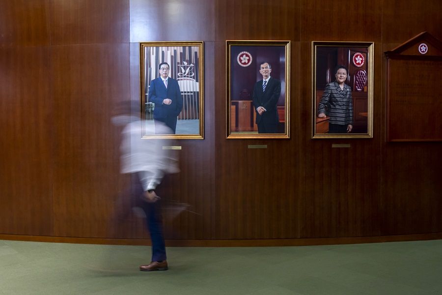 A person walks past portraits of current and former Legislative Council presidents Andrew Leung (left), Jasper Tsang (centre), and Rita Fan at the Legislative Council in Hong Kong, China on 26 May 2021. (Paul Yeung/Bloomberg)