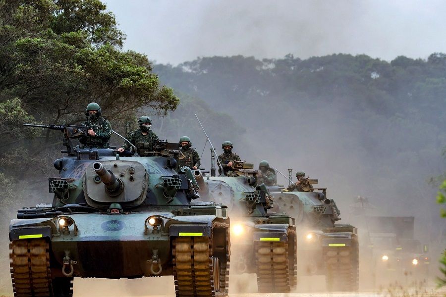 This handout photo from Taiwan's Ministry of National Defense taken on 9 April 2023 shows Taiwanese soldiers operating tanks during a drill in an undisclosed location in Taiwan. (Handout/Taiwan's Ministry of National Defense/AFP)