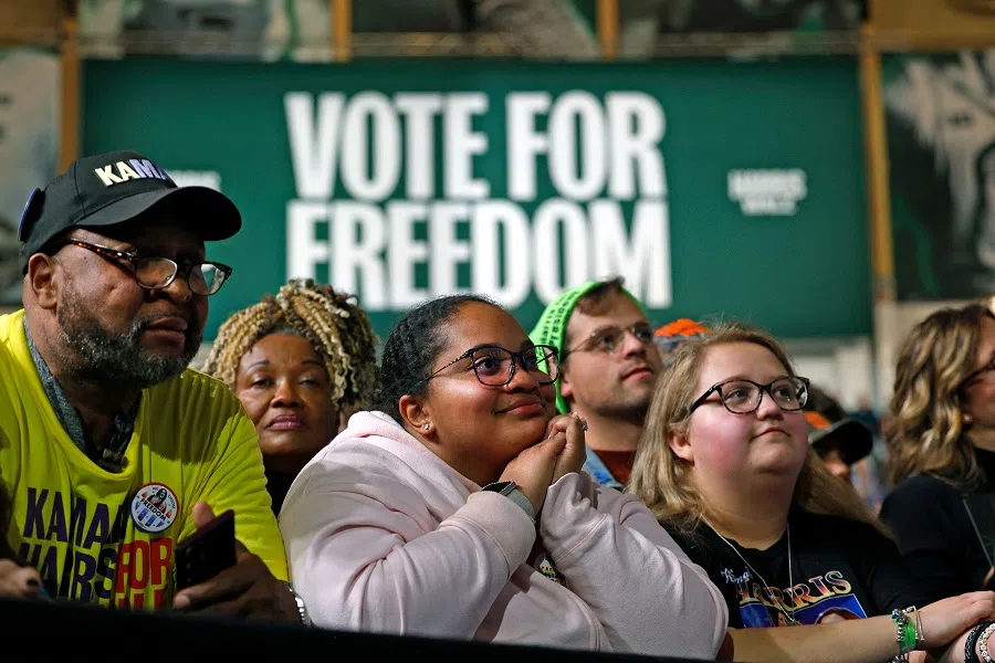 Supporters listen to US Vice President and Democratic presidential nominee Kamala Harris speak during a campaign rally at Michigan State University’s Jenison Field House in East Lansing, Michigan, US, on 3 November 2024. (Jeff Kowalsky/AFP)
