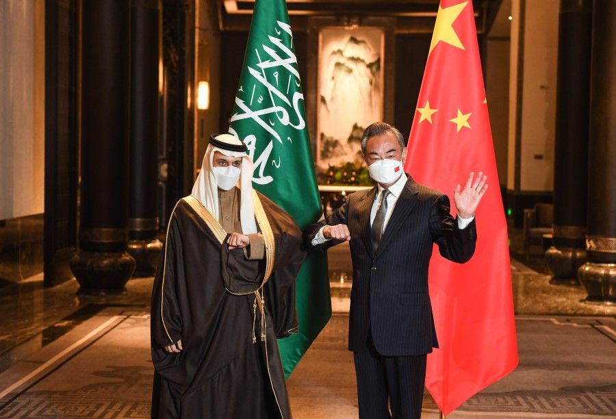 Chinese Foreign Minister Wang Yi with Saudi Arabia's Foreign Minister Prince Faisal bin Farhan Al Saud in Jiangsu, 10 January 2022. (Xinhua)