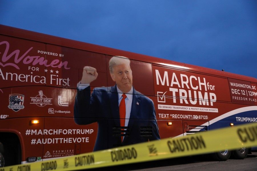 A bus with the image of US President Donald Trump on it is seen during an event to show support for him in Macomb County, Michigan, 8 December 2020. (Emily Elconin/REUTERS)