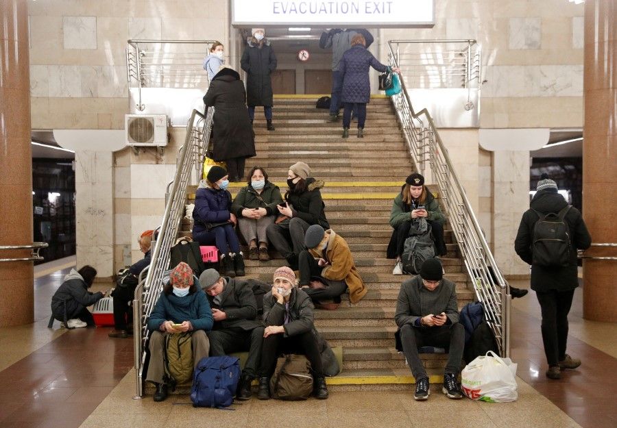 People take shelter in a subway station, after Russian President Vladimir Putin authorised a military operation in eastern Ukraine, in Kyiv, Ukraine, 24 February 2022. (Valentyn Ogirenko/Reuters)