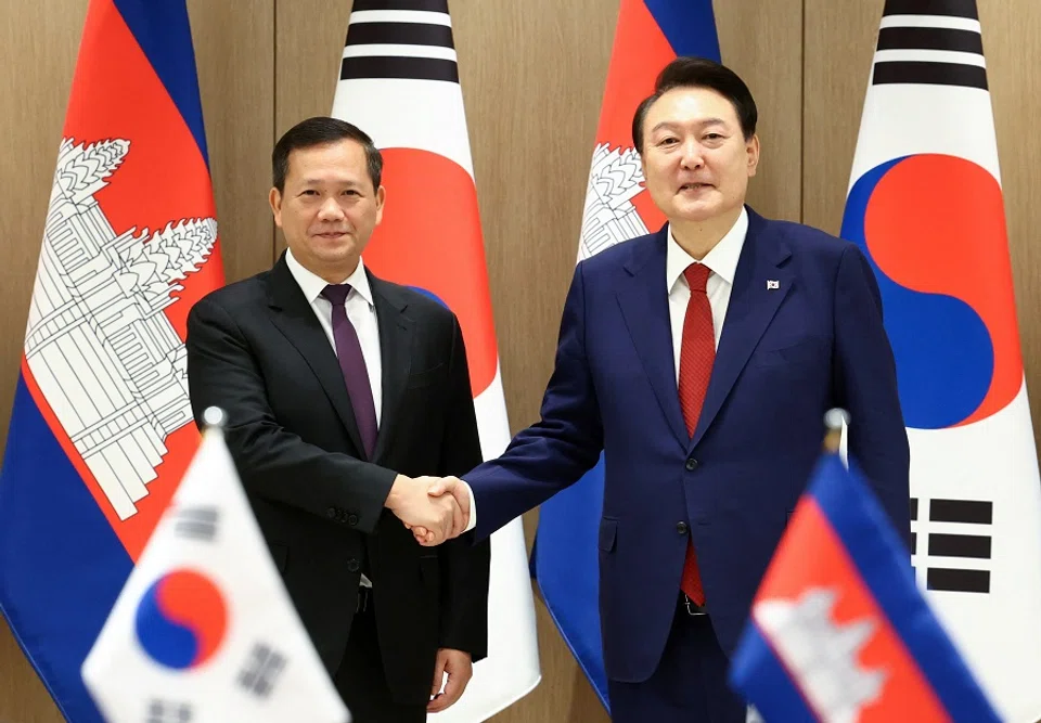 Cambodian Prime Minister Hun Manet shakes hands with South Korean President Yoon Suk Yeol at the Presidential Office in Seoul, South Korea on 16 May 2024.  (Yonhap via Reuters)