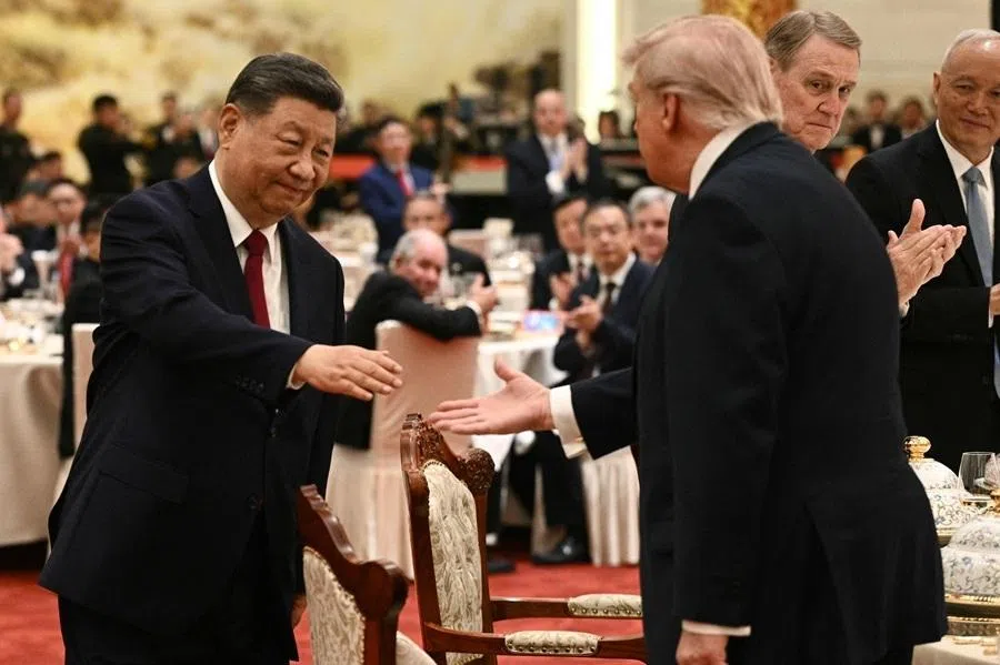 Chinese President Xi Jinping shakes hands with US President Donald Trump at a state banquet at the Great Hall of the People in Beijing on 14 May 2026.