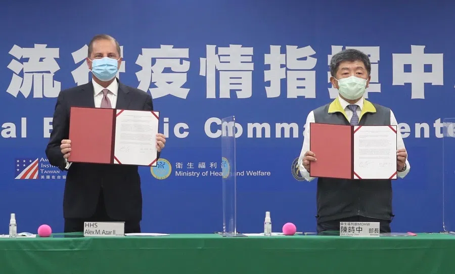 Secretary of US Health and Human Services Alex Azar (left) and Taiwan's Minister of Health and Welfare Chen Shih-chung display the signed documents during a memorandum of understanding signing ceremony at the Centers for Disease Control (CDC) in Taipei on 10 August 2020. (Pei Chen/POOL/AFP)