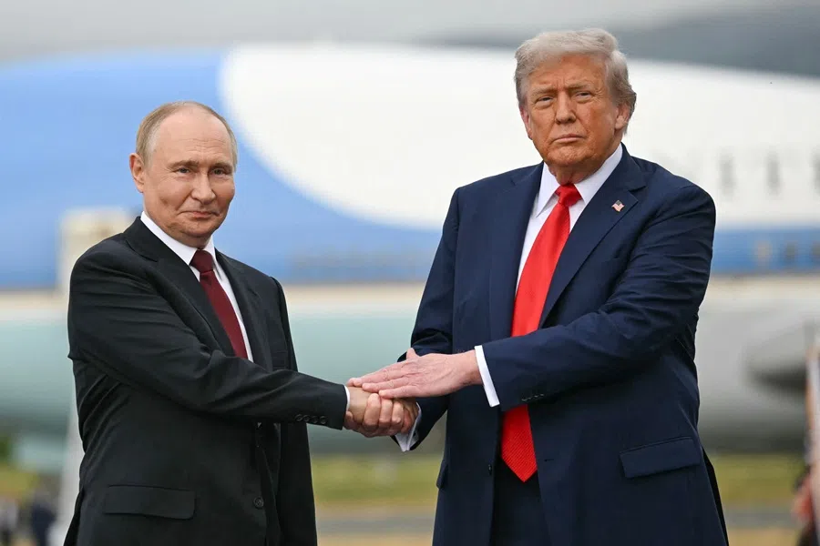 US President Donald Trump greets Russian President Vladimir Putin on the tarmac after arriving at Joint Base Elmendorf-Richardson in Anchorage, Alaska, on 15 August 2025. (Andrew Caballero-Reynolds/AFP)