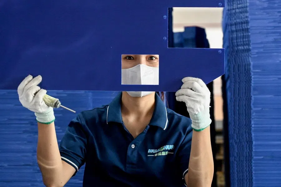 This photo taken on 28 July 2025 shows a worker at the Huashuo Vietnam Plastics Company factory in Hai Phong.