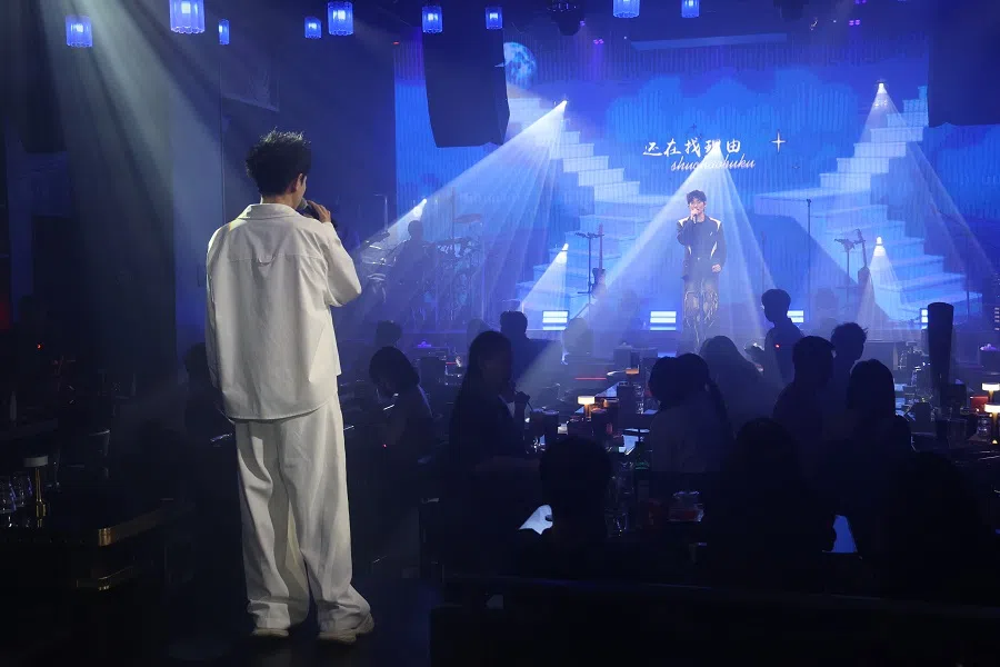 Two singers belt out a duet at Red Live House. (Vincent Woo/SPH Media)