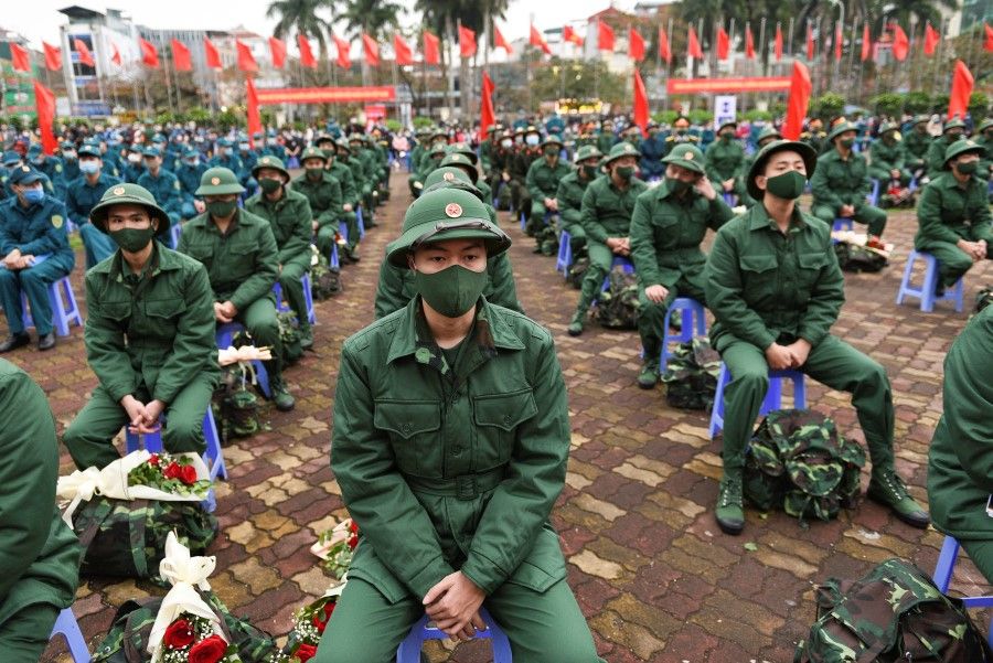 Vietnamese military new recruits at a ceremony before leaving for military service, in Hanoi, Vietnam, 27 February 2021. (Thanh Hue/Reuters)