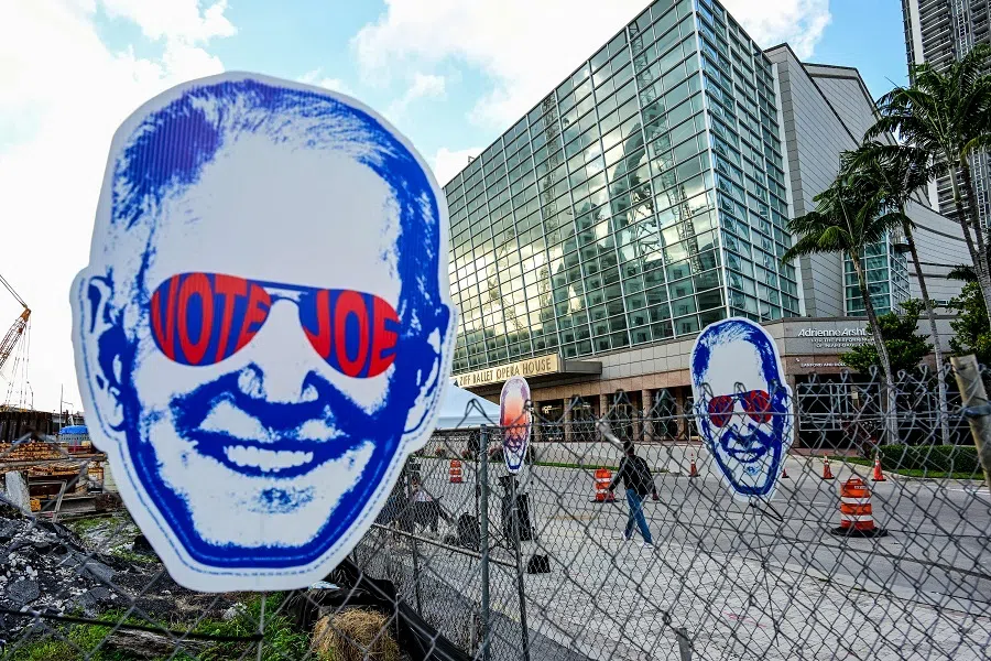 Signs supporting US President Joe Biden are displayed outside the Adrienne Arsht Center for the Performing Arts ahead of the third Republican presidential debate, in Miami, Florida, US, on 8 November 2023. (Giorgio Viera/AFP)