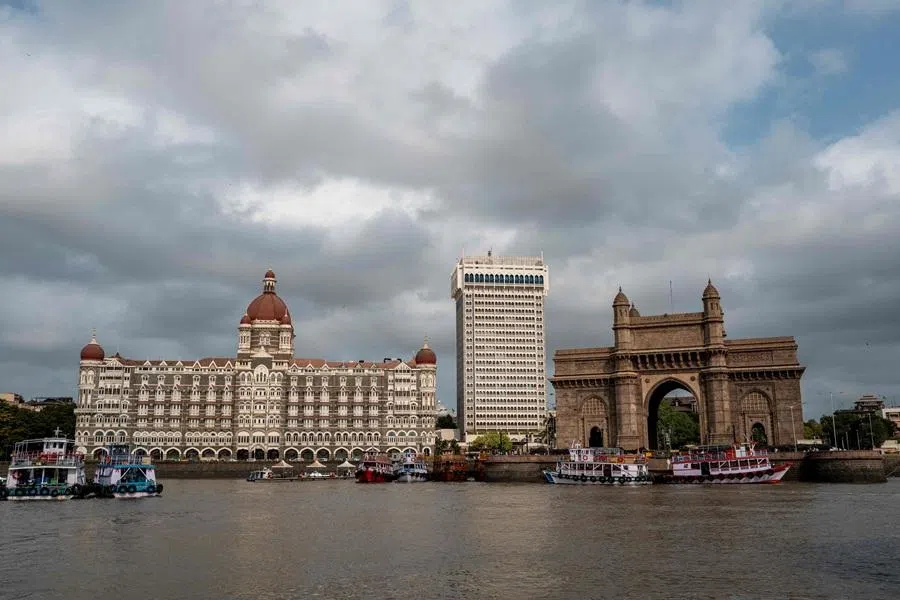 Boats lie anchored in front of the Gateway of India and the Taj Mahal Palace hotel in Mumbai on 1 April 2026. (Punit Paranjpe/AFP)