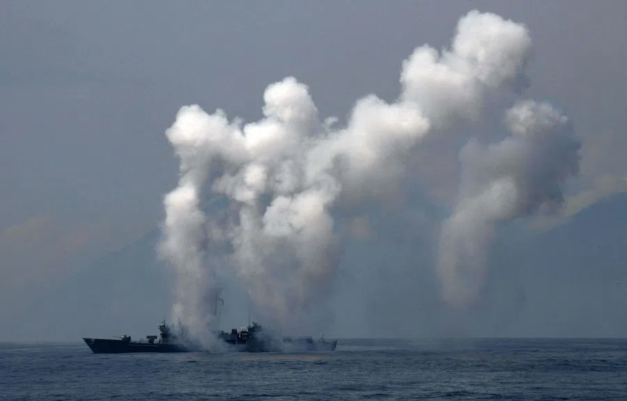 This file photo taken on 13 April 2018 shows a frigate launching chaff and flare during a drill at the sea near the Suao navy harbour in Yilan. (Sam Yeh/AFP)