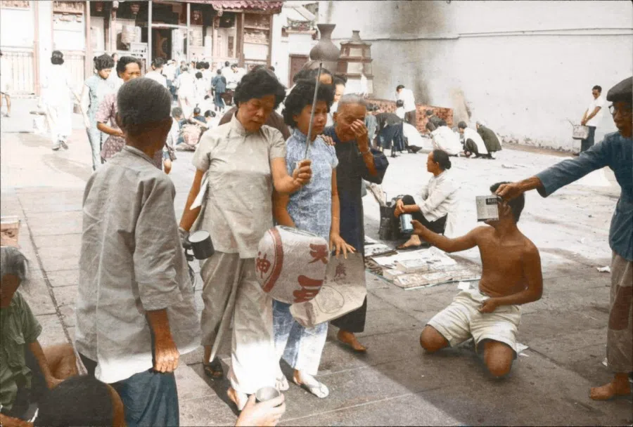 In the 1950s, panhandling outside temples was common, and poverty was visible everywhere.