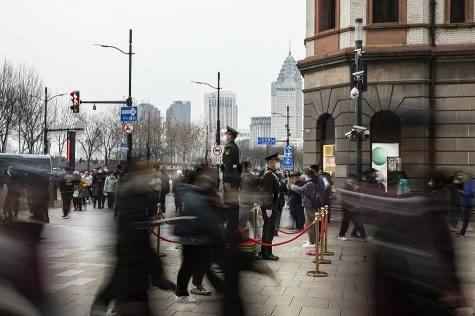 Members of the People's Armed Police stand guard near the Bund in Shanghai, China, on 28 February 2023. (Qilai Shen/Bloomberg)