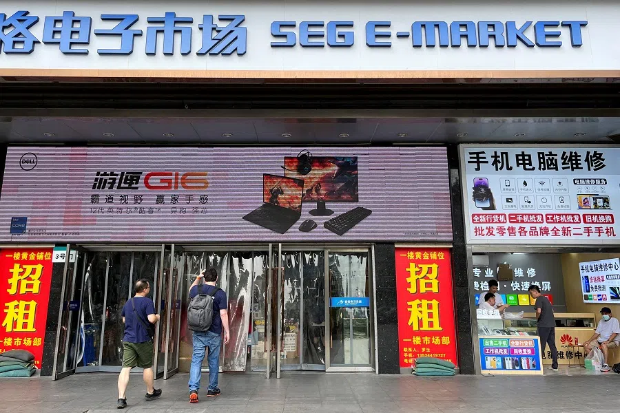 People enter the SEG E-Market at Huaqiangbei electronics market in Shenzhen, Guangdong province, China, on 8 June 2023. (David Kirton/Reuters)