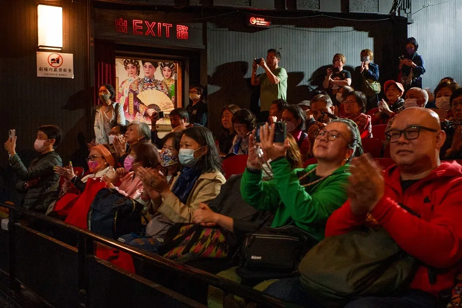 The audience applauds as they pack the 1,000-seat Sunbeam Theatre to bid farewell to the iconic opera house in the North Point district of Hong Kong early on 4 March 2025. (Yan Zhao/AFP)