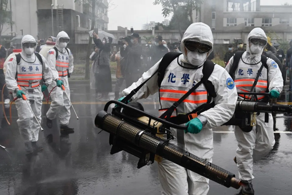 Soldiers from the military's chemical units take part in a drill organised by the New Taipei City government to prevent the spread of the Covid-19 coronavirus, in Xindian district on March 14, 2020. Over 450 medical staff, community volunteers, government employees and military personnel took part in the drill. Taiwan has won praise for its handling of the epidemic. (Sam Yeh/AFP)