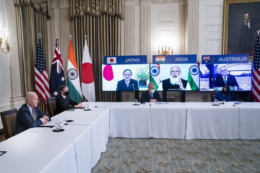 US President Joe Biden (left), and Secretary of State Antony Blinken, (second from left), attend a virtual Quadrilateral Security Dialogue (Quad) meeting with leaders of Japan, Australia and India in the State Dining Room of the White House in Washington, DC, US, on 12 March 2021. (Jim Lo Scalzo/EPA/Bloomberg)