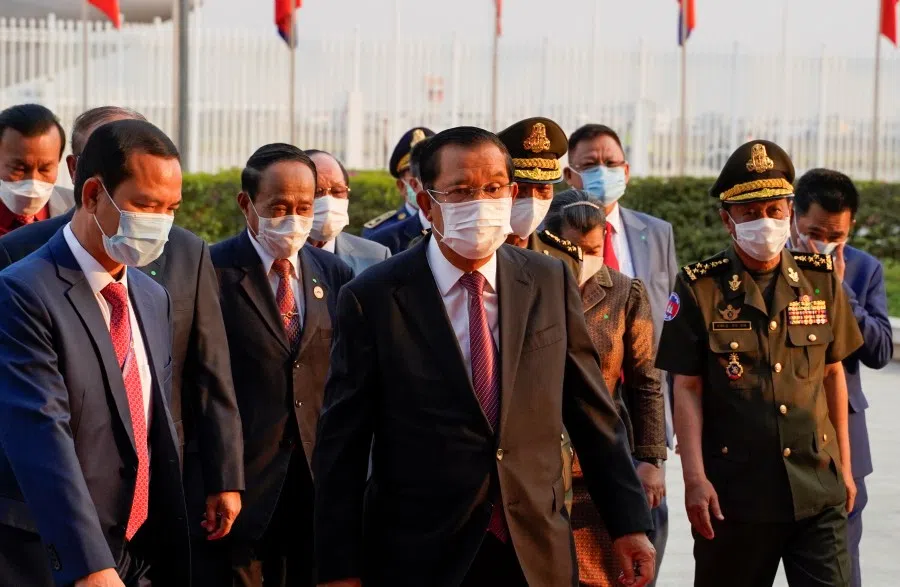 Cambodian Prime Minister Hun Sen arrives to receive a shipment of 600,000 doses of the coronavirus disease (COVID-19) vaccines donated by China from Ambassador Wang Wentian, at the Phnom Penh International Airport, in Phnom Penh, Cambodia February 7, 2021. (Cindy Liu/Reuters)