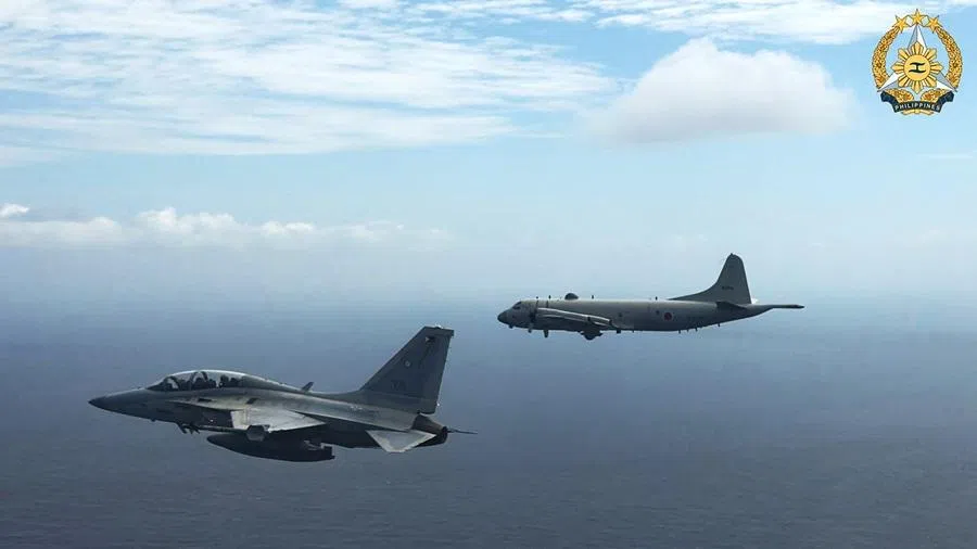 This handout photo taken on 26 February 2026 and released on 27 February by the Armed Forces of the Philippines-Public Affairs Office (AFP-PAO) shows a Philippine air force FA-50 fighter jet (left) flying alongside a Japan Maritime Self-Defense Force's P-3 Orion maritime patrol aircraft during a joint military exercise in the disputed South China Sea.