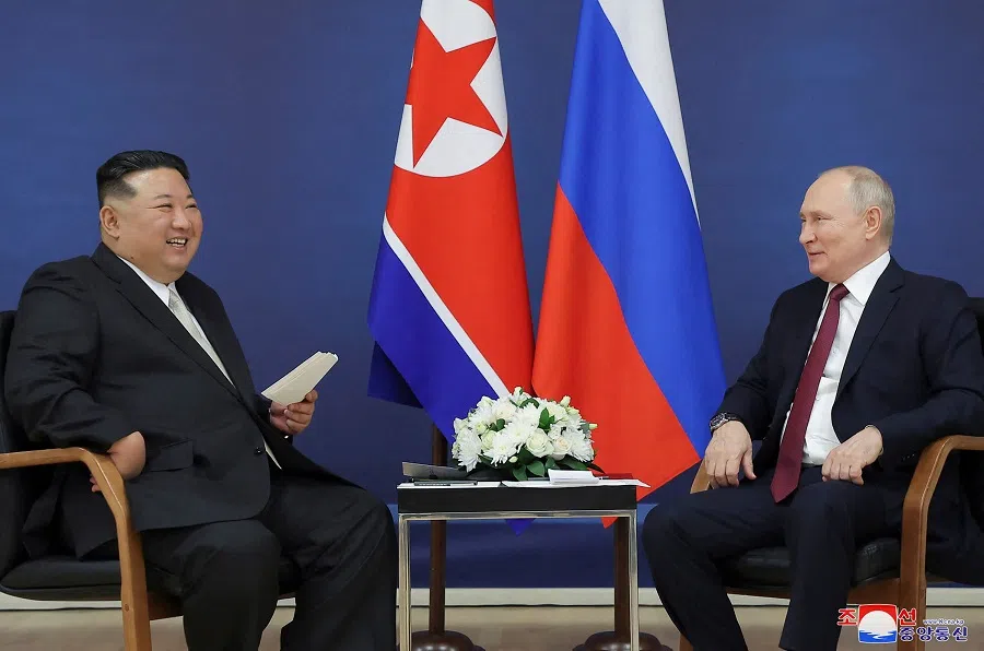 This picture taken on 13 September 2023 and released by North Korea's official Korean Central News Agency (KCNA) on 14 September shows North Korea's leader Kim Jong-un (left) meeting with Russia's President Vladimir Putin at the Vostochny Cosmodrome in Russia's Amur region. (KCNA via KNS/AFP)