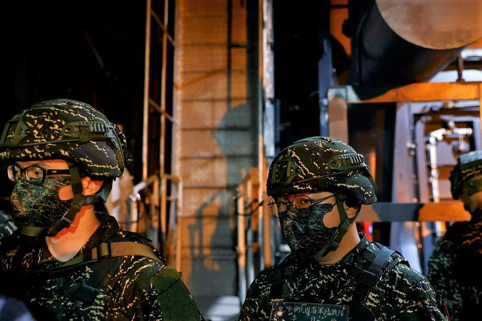 Members of Taiwan's armed forces participate in a two-day routine drill to show combat readiness, at a military base in Kaohsiung, Taiwan, 12 January 2023. (Ann Wang/Reuters)