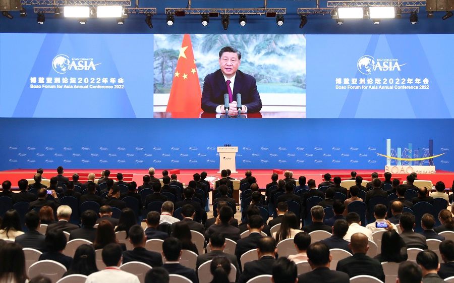 A screen shows Chinese President Xi Jinping delivering a keynote speech at the opening ceremony of the Boao Forum for Asia via video link, at a media centre in Boao, Hainan province, China, 21 April 2022. (Xinhua)