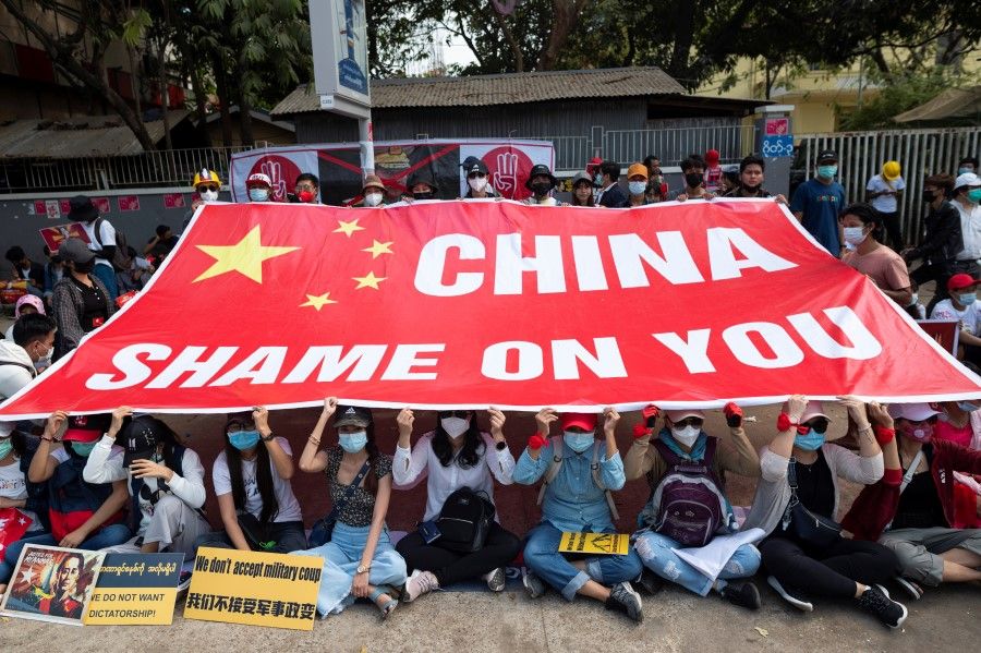 Demonstrators protest outside the Chinese embassy against the military coup in Yangon, Myanmar, 19 February 2021. (Stringer/Reuters)